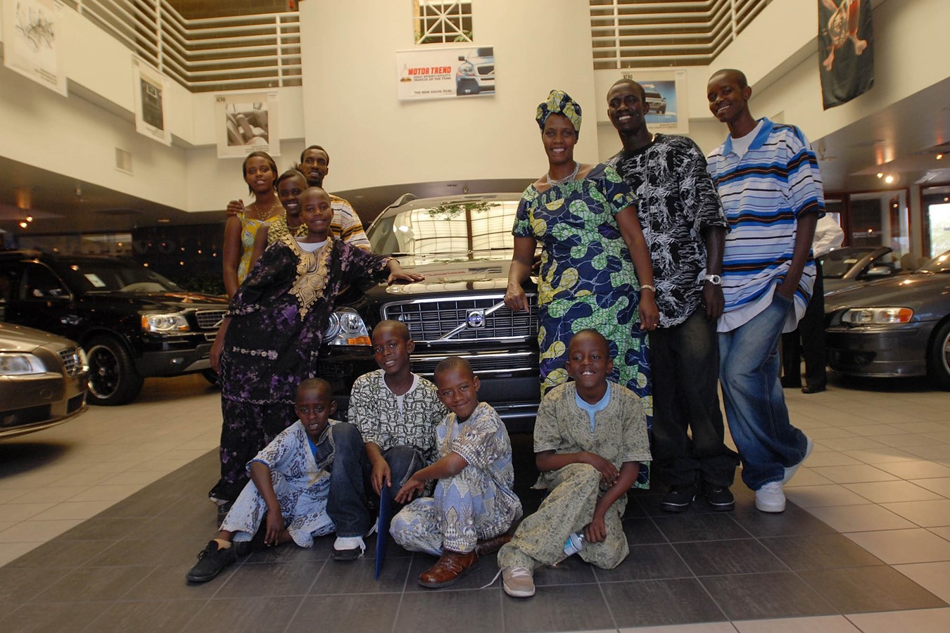 Fifth Annual Volvo for life Awards grand winner, Rose Mapendo, with her 10 children receiving a new Volvo