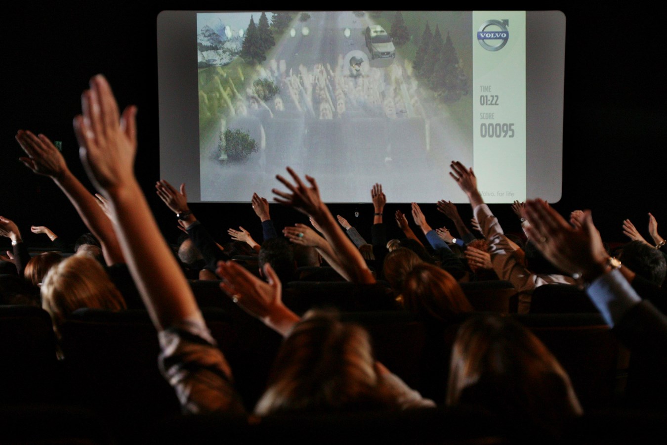 Cinema audience, waving their arms to guide the new Volvo XC70, Volvo Car UK