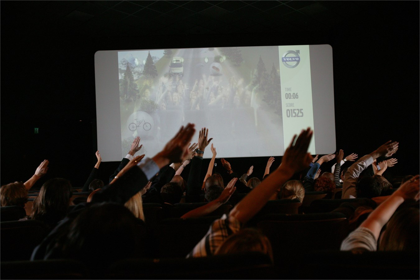 Cinema audience, waving their arms to guide the new Volvo XC70, Volvo Car UK