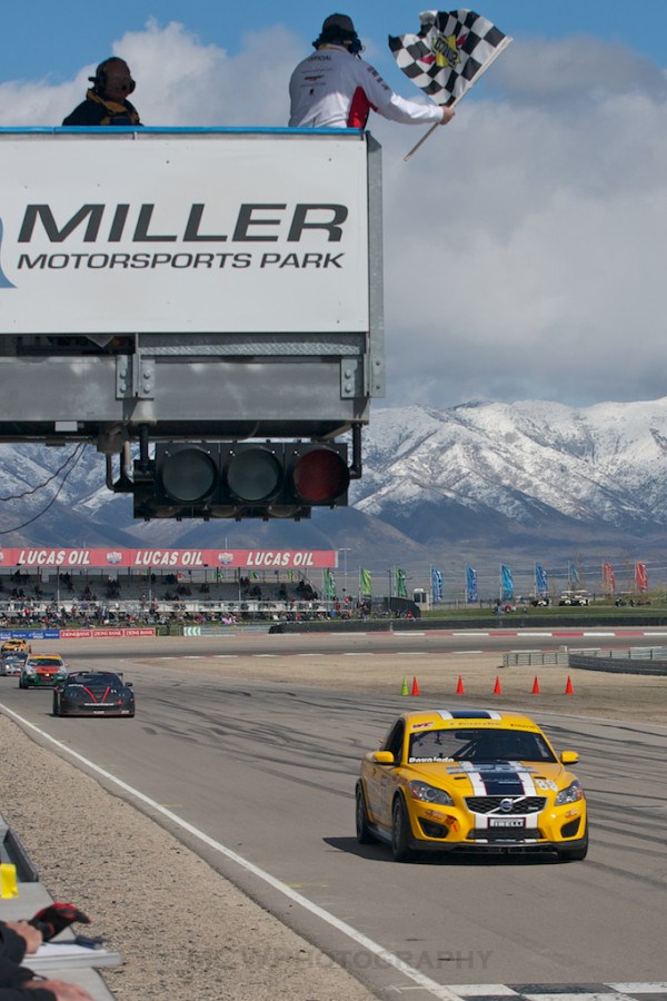 Aaron Povoledo takes the checkered flag at Miller Motorsports Park in Utah.