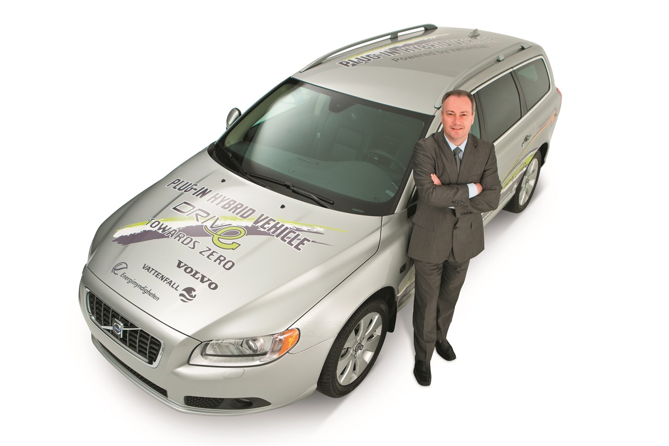 Stephen Odell, President and CEO of Volvo Car Corporation and the Volvo V70 Plug-in hybrid demonstration car.